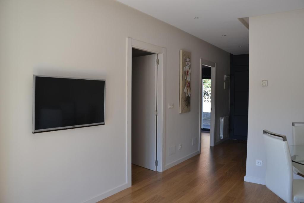 TV a/nebo společenská místnost v ubytování Costa Quebrada Apartamentos