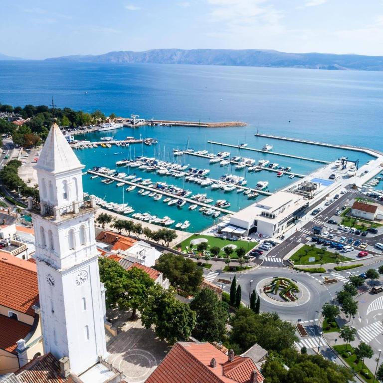 an aerial view of a marina with a clock tower at Bell Tower House in Novi Vinodolski