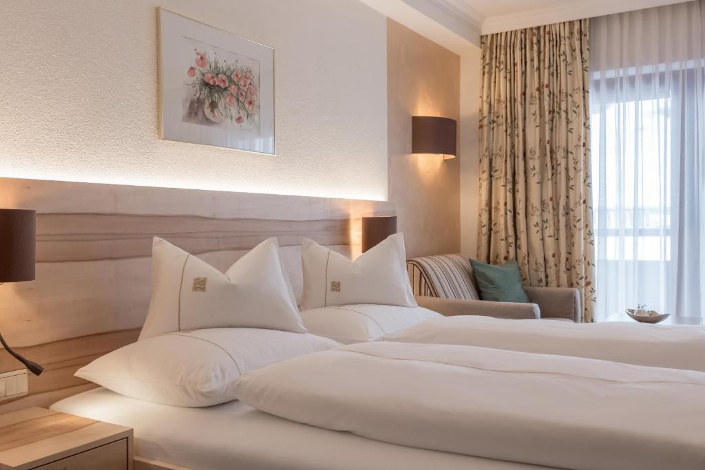 Postel nebo postele na pokoji v ubytování Hotel Madeleine