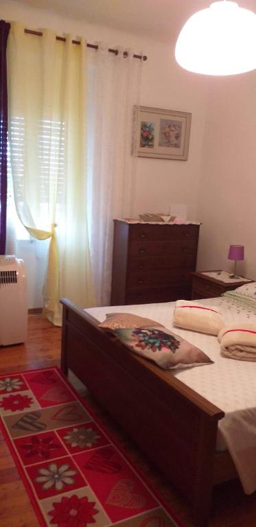 Łóżko lub łóżka w pokoju w obiekcie Casa Vacanze Poison