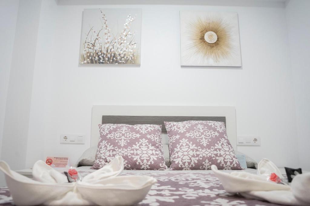 Cama o camas de una habitación en Hostal Goyesco Plaza