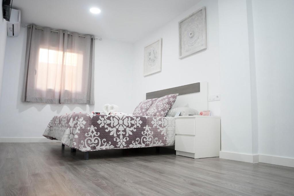 Cama o camas de una habitación en Hostal Goyesco Plaza