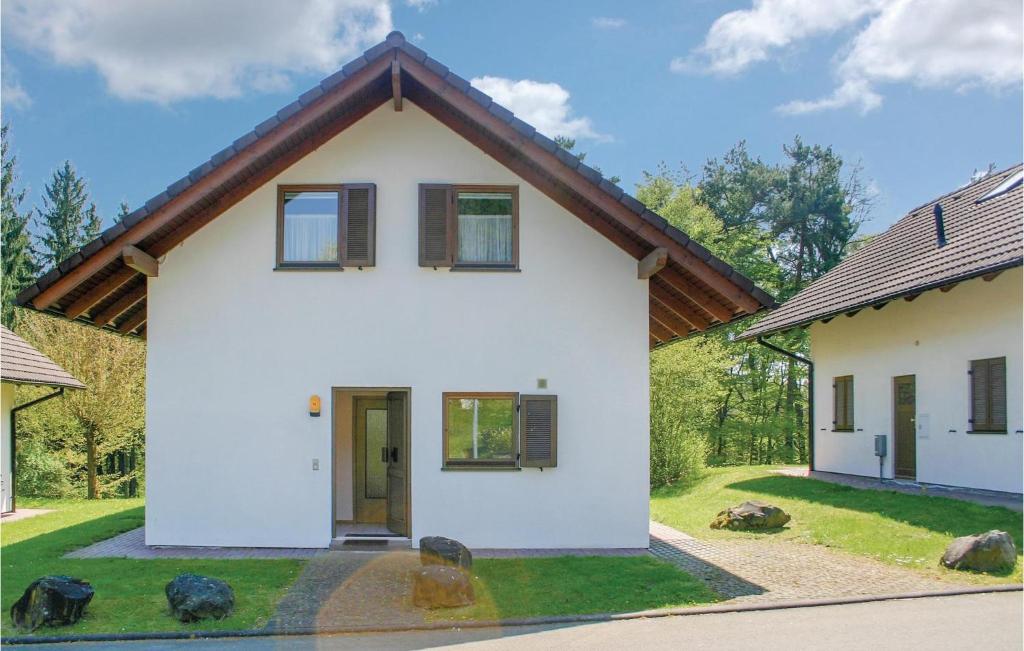 a white house with a brown roof at Ferienhaus 15 In Kirchheim in Kirchheim