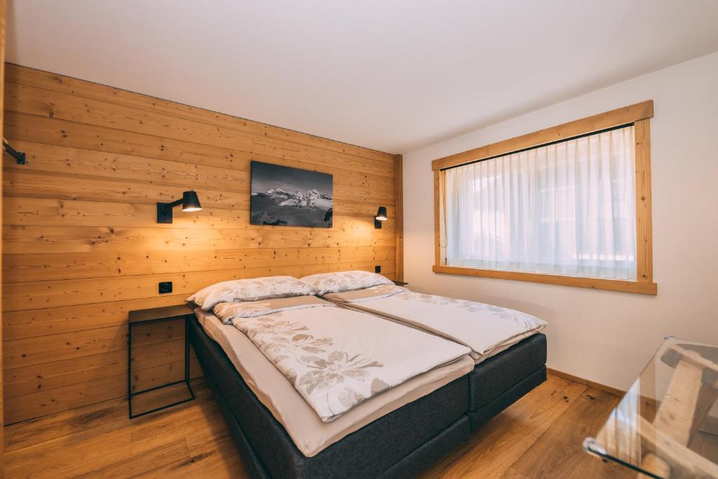 Postel nebo postele na pokoji v ubytování Apart Lodge belMont
