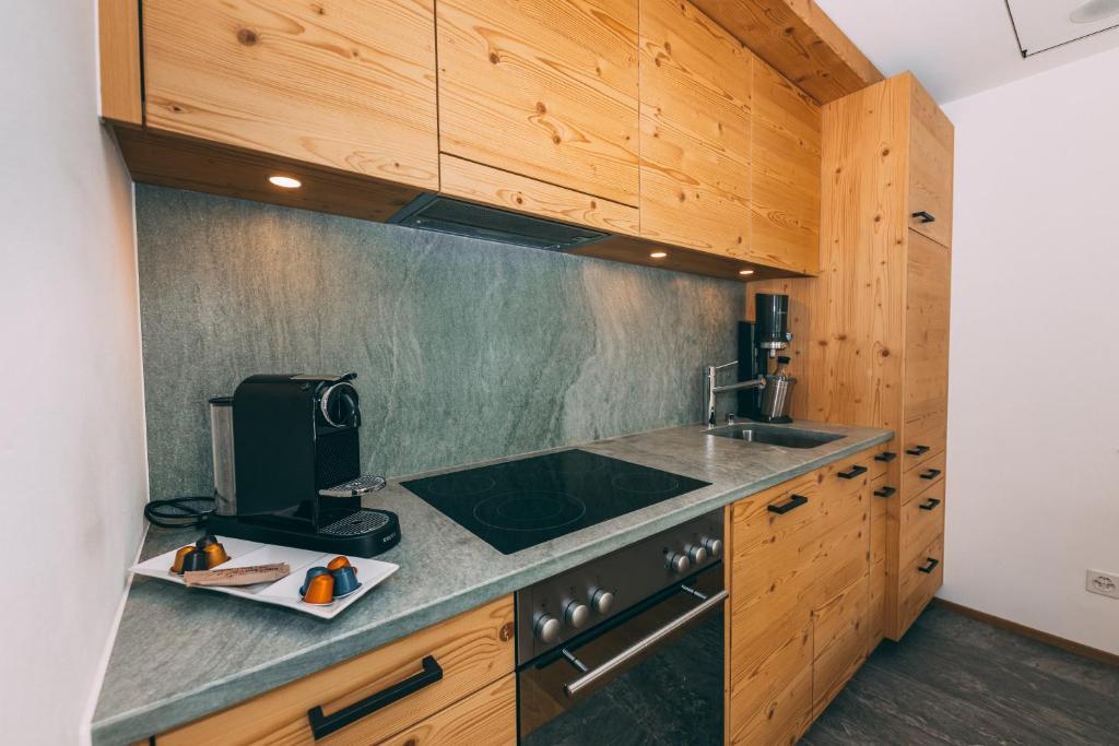 Kuchyň nebo kuchyňský kout v ubytování Apart Lodge belMont