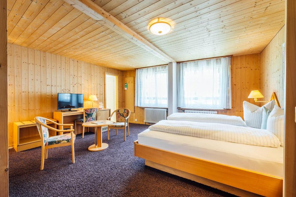 Postel nebo postele na pokoji v ubytování Hotel-Restaurant Bellevue