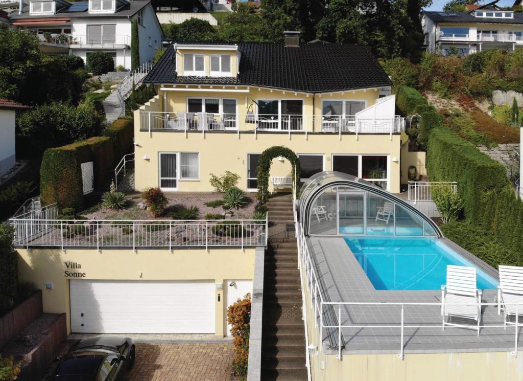 an aerial view of a house with a swimming pool at Villa Sonne in Bodman-Ludwigshafen