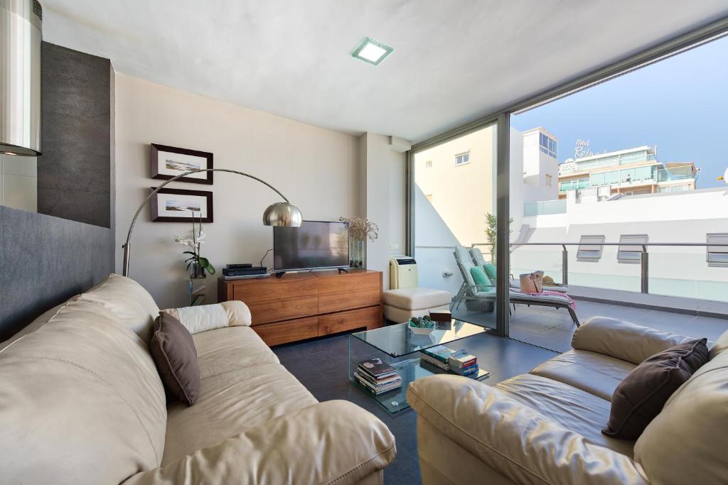 A seating area at Living Las Canteras Homes - LAS CANTERAS PENTHOUSE