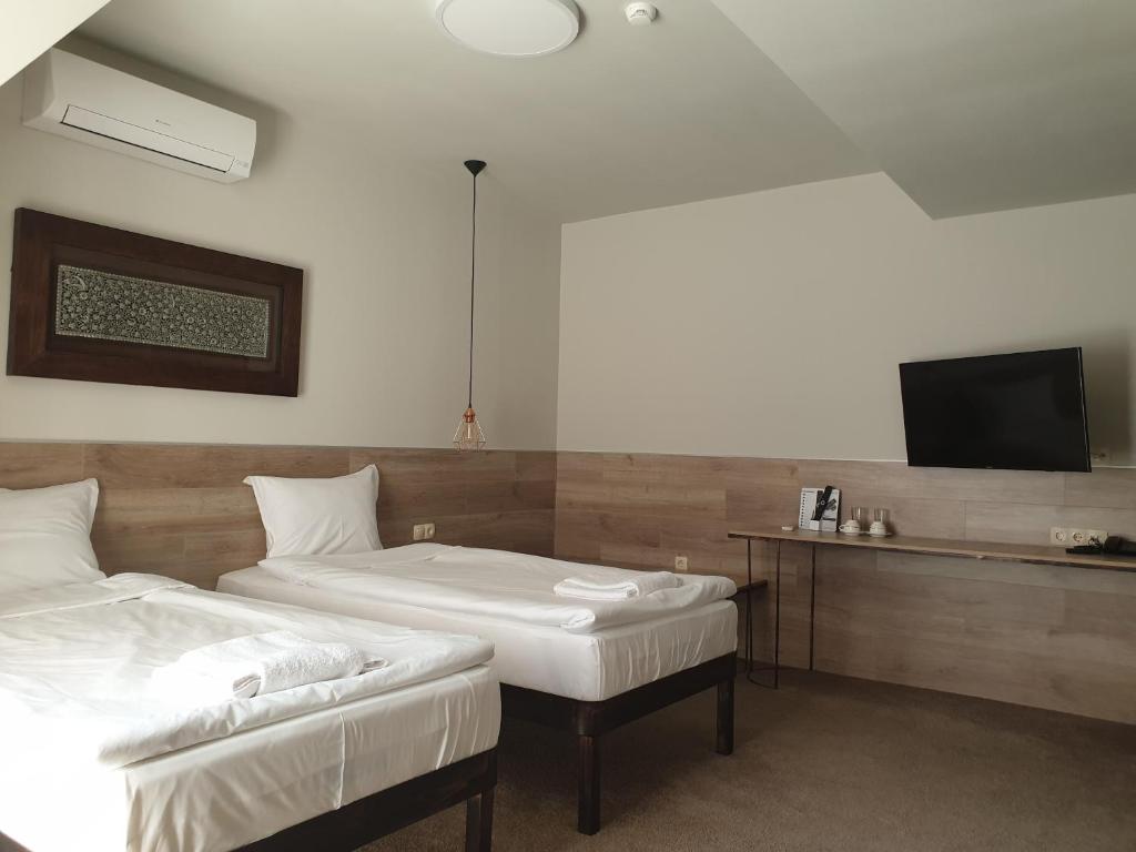 Postel nebo postele na pokoji v ubytování Clepsydra Residence