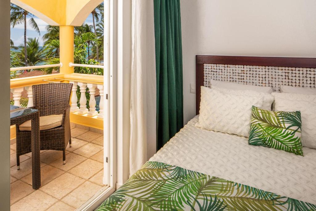 Postel nebo postele na pokoji v ubytování Hotel Villa Taina