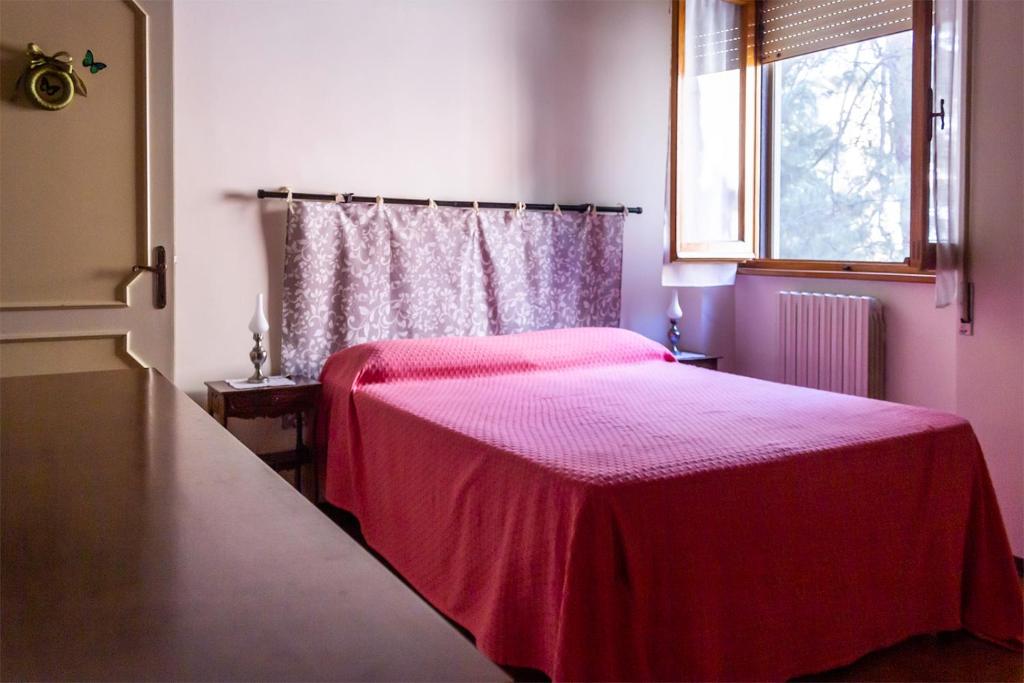 Posteľ alebo postele v izbe v ubytovaní Casa dei Laghi