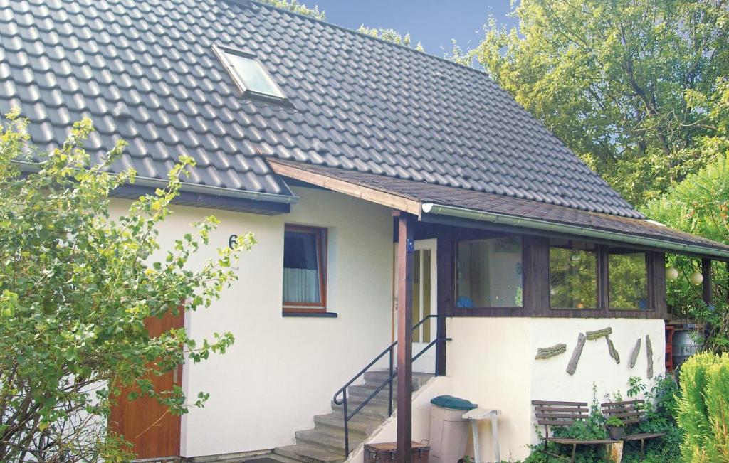 a small white house with a roof at Beautiful Home In Zechin- Friedrichsaue With Kitchen in Friedrichsaue