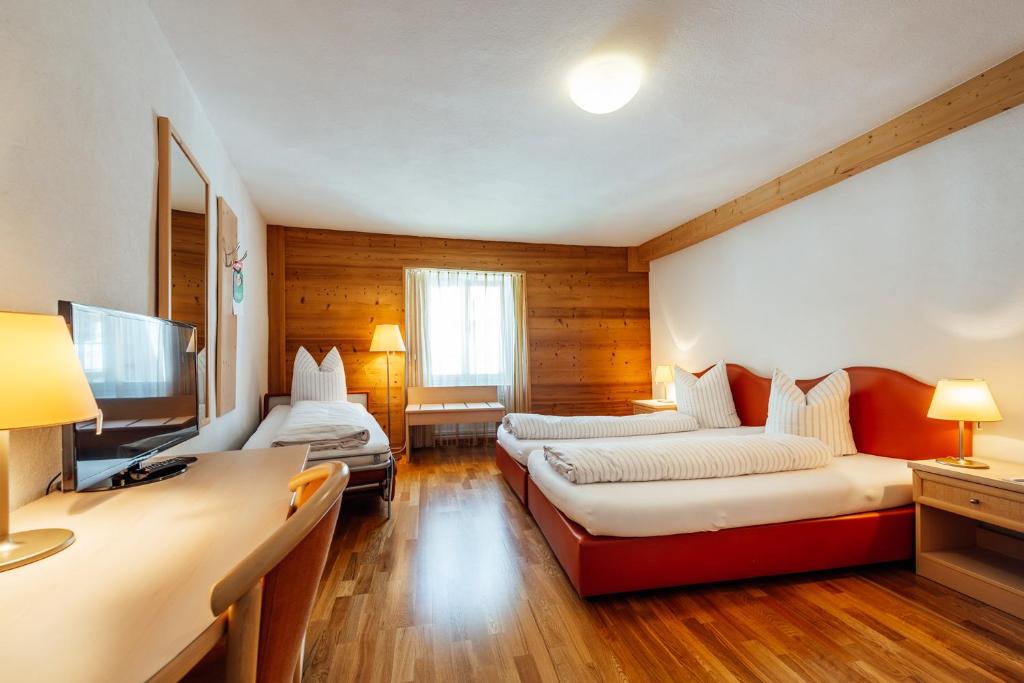 Postel nebo postele na pokoji v ubytování Hotel-Restaurant Bellevue