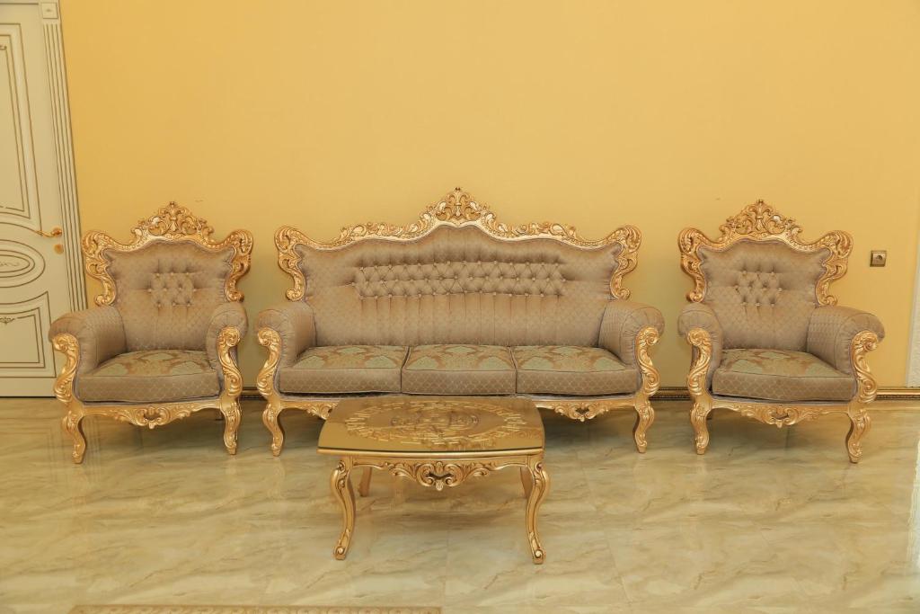 a room with two couches and a coffee table at AL SHEIKH 5 BEDROOM LUXURY APARTMENT 1 in Yerevan
