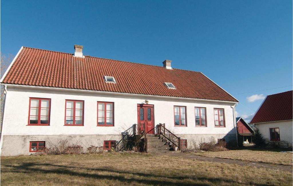 a large white house with a red door at Awesome Apartment In Hemse With Wifi in Hemse