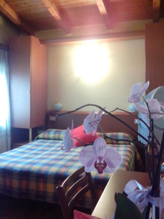 Postel nebo postele na pokoji v ubytování Hotel Monte Fior
