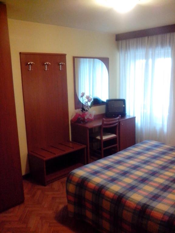 Postel nebo postele na pokoji v ubytování Hotel Monte Fior