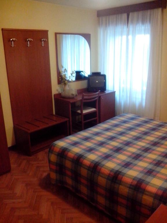 Postel nebo postele na pokoji v ubytování Hotel Monte Fior