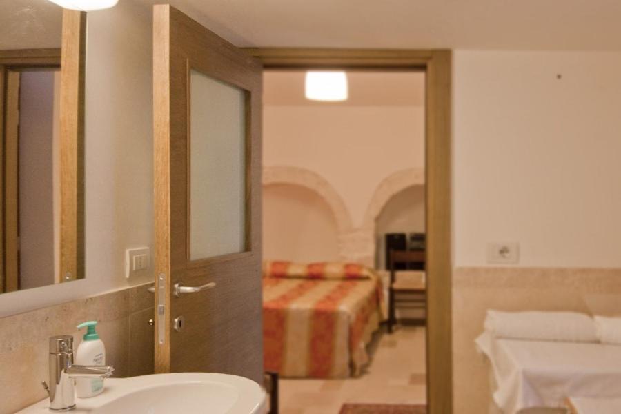 Łóżko lub łóżka w pokoju w obiekcie Grotta Cilicia B&B