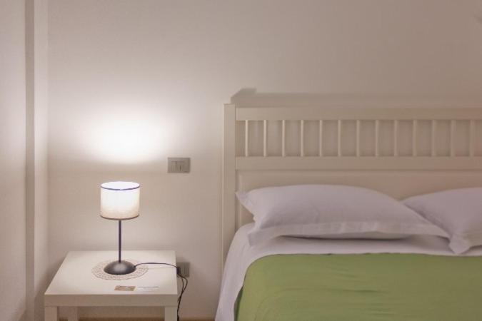 Łóżko lub łóżka w pokoju w obiekcie Grotta Cilicia B&B