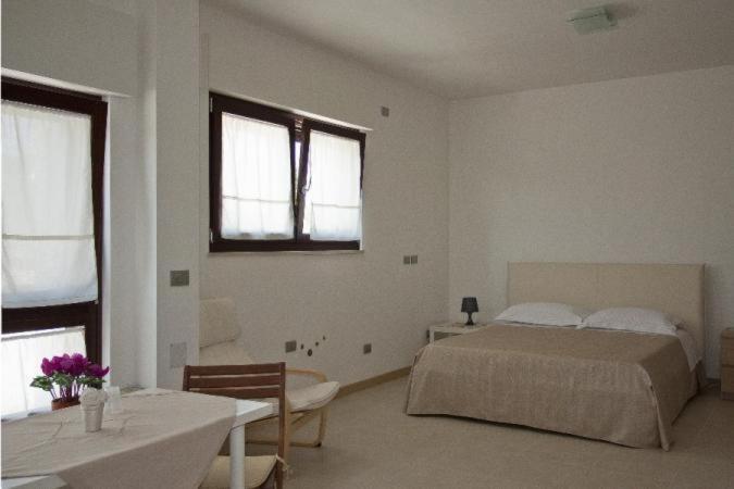 Łóżko lub łóżka w pokoju w obiekcie Grotta Cilicia B&B