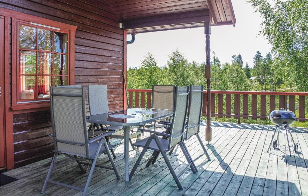 a patio with a table and chairs on a deck at Stunning Home In mli With 4 Bedrooms in Felli
