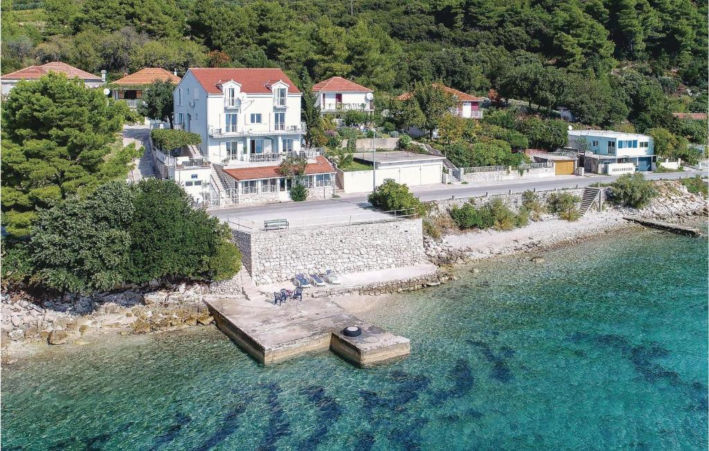 an aerial view of a small island in the water at 9 Bedroom Pet Friendly Home In Kuciste in Kučište