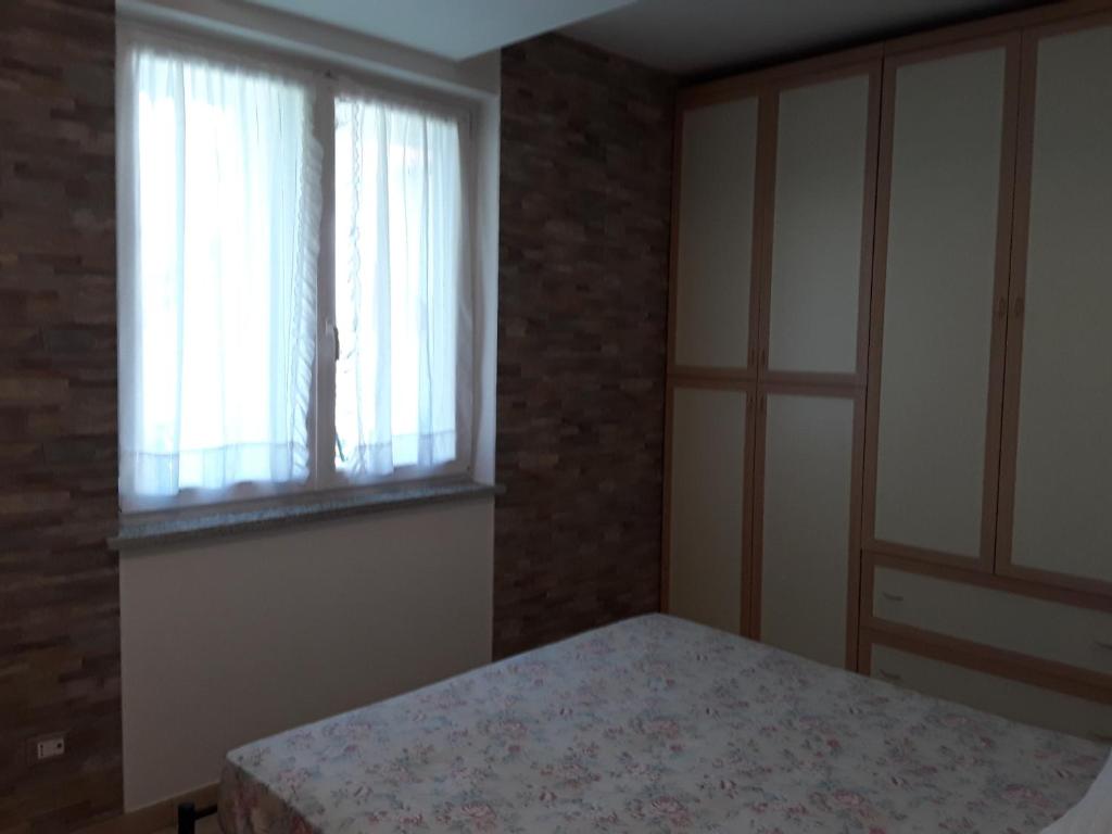 Postel nebo postele na pokoji v ubytování G&G1 Appartamento con giardino privato