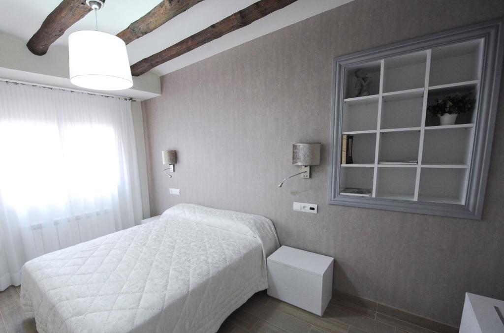 Postel nebo postele na pokoji v ubytování Apartamentos Turísticos Mirablanc
