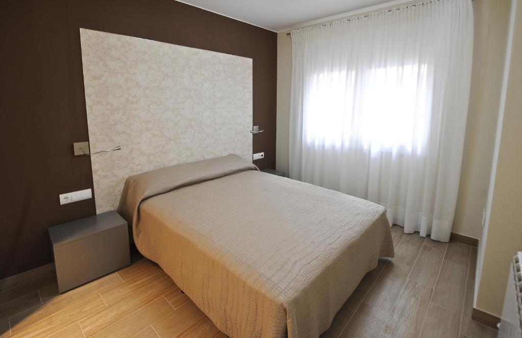 Postel nebo postele na pokoji v ubytování Apartamentos Turísticos Mirablanc