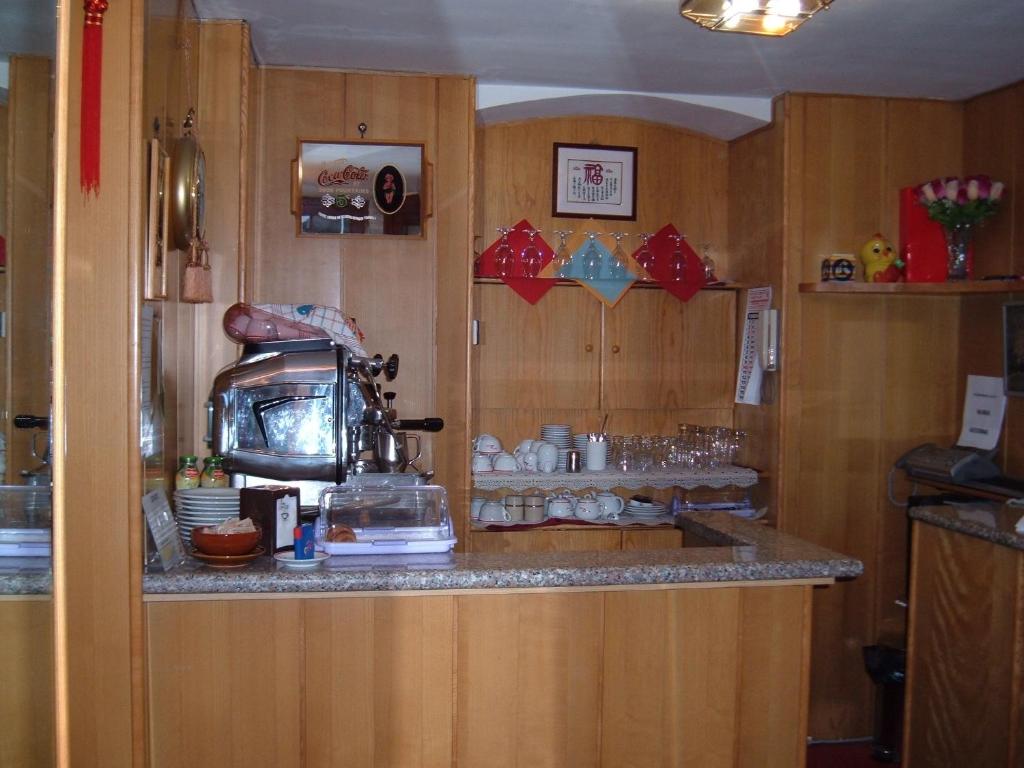 Kuchyň nebo kuchyňský kout v ubytování Albergo Luca