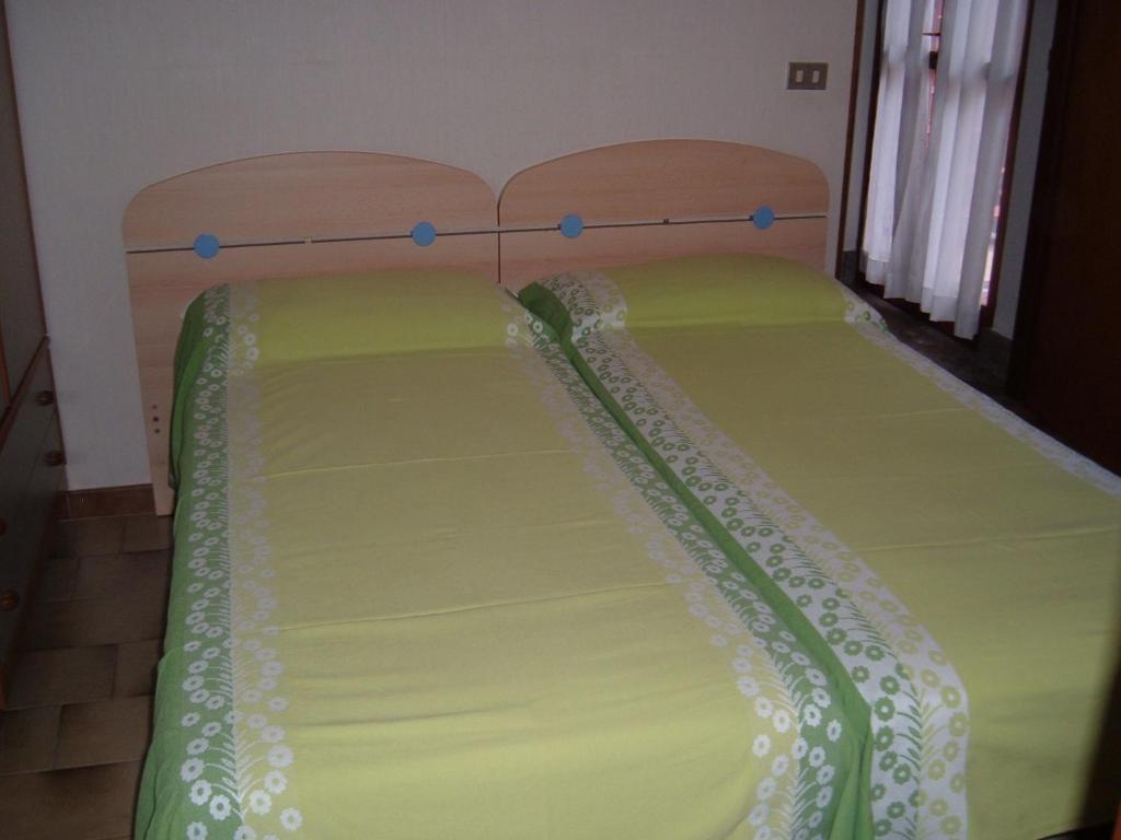 Postel nebo postele na pokoji v ubytování Albergo Luca