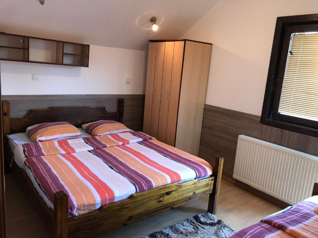 Postel nebo postele na pokoji v ubytování Vila Zlatarka