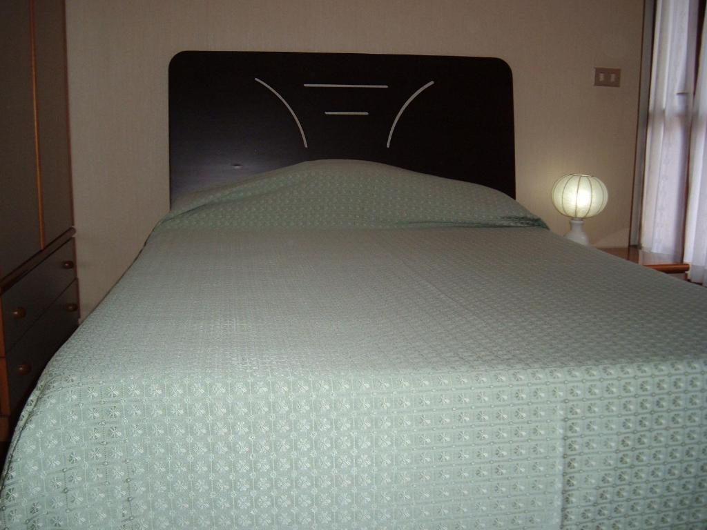 Postel nebo postele na pokoji v ubytování Albergo Luca