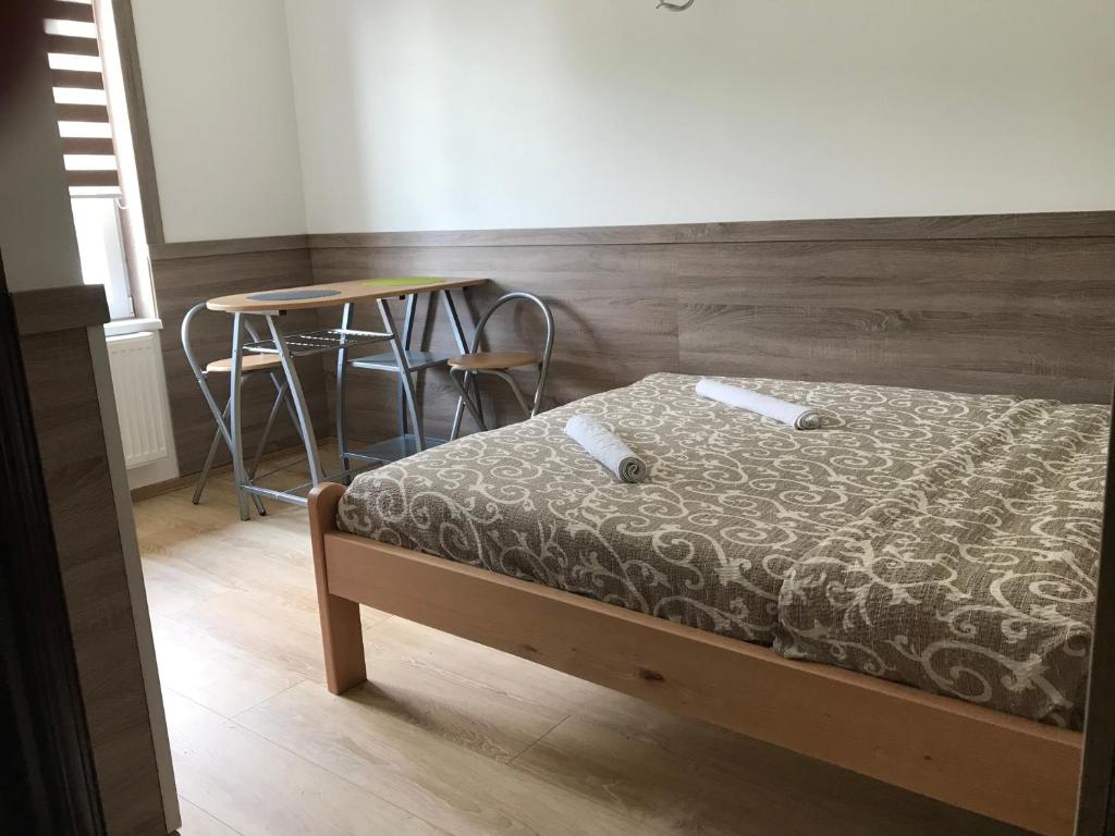 Postel nebo postele na pokoji v ubytování Vila Zlatarka