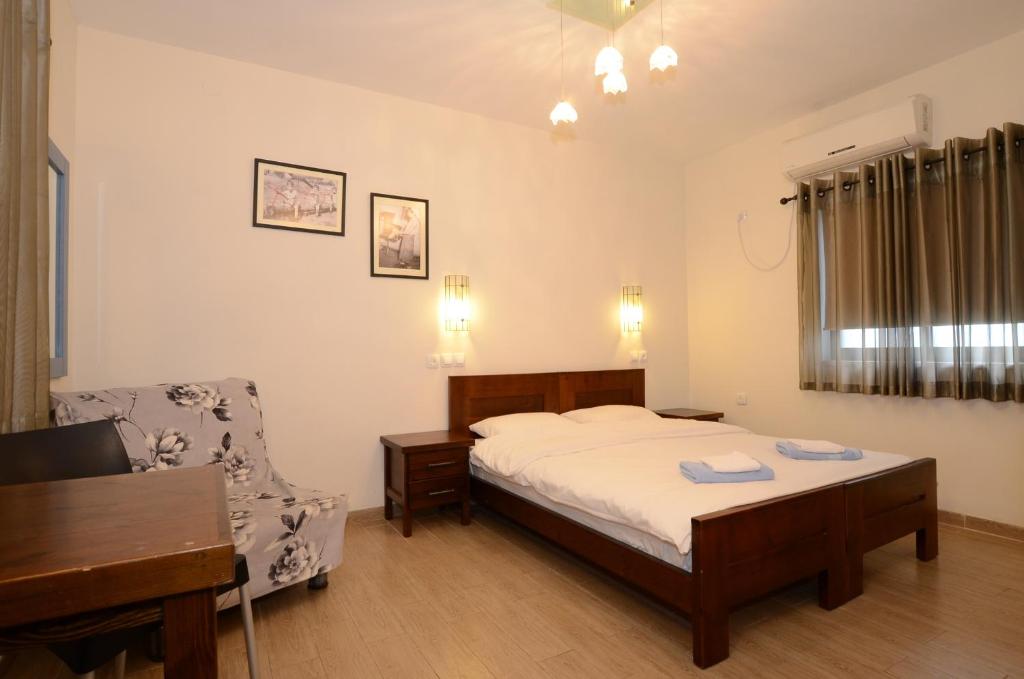 Postel nebo postele na pokoji v ubytování כפר הנופש קיבוץ גדות Kibbutz Gadot Galilean Resort