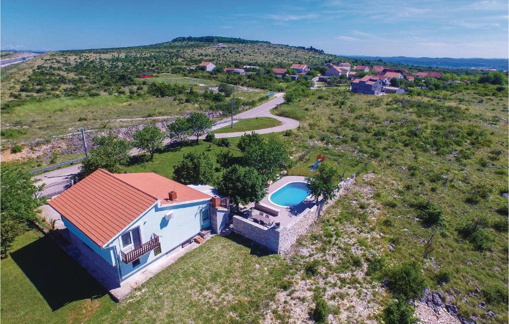 an aerial view of a house with a swimming pool at Nice Home In Nadin With Wifi in Nadin