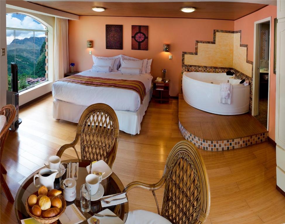 Postel nebo postele na pokoji v ubytování Hotel Taypikala Machupicchu