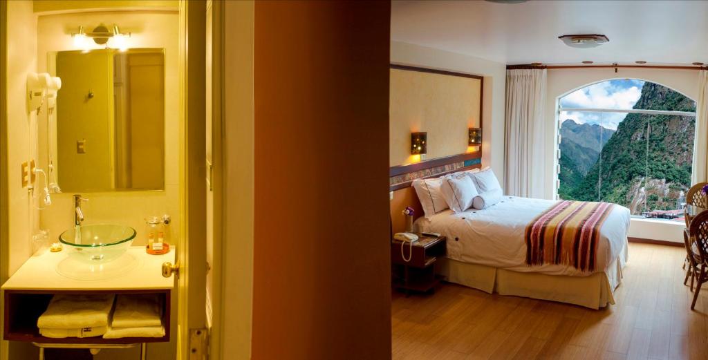 Postel nebo postele na pokoji v ubytování Hotel Taypikala Machupicchu