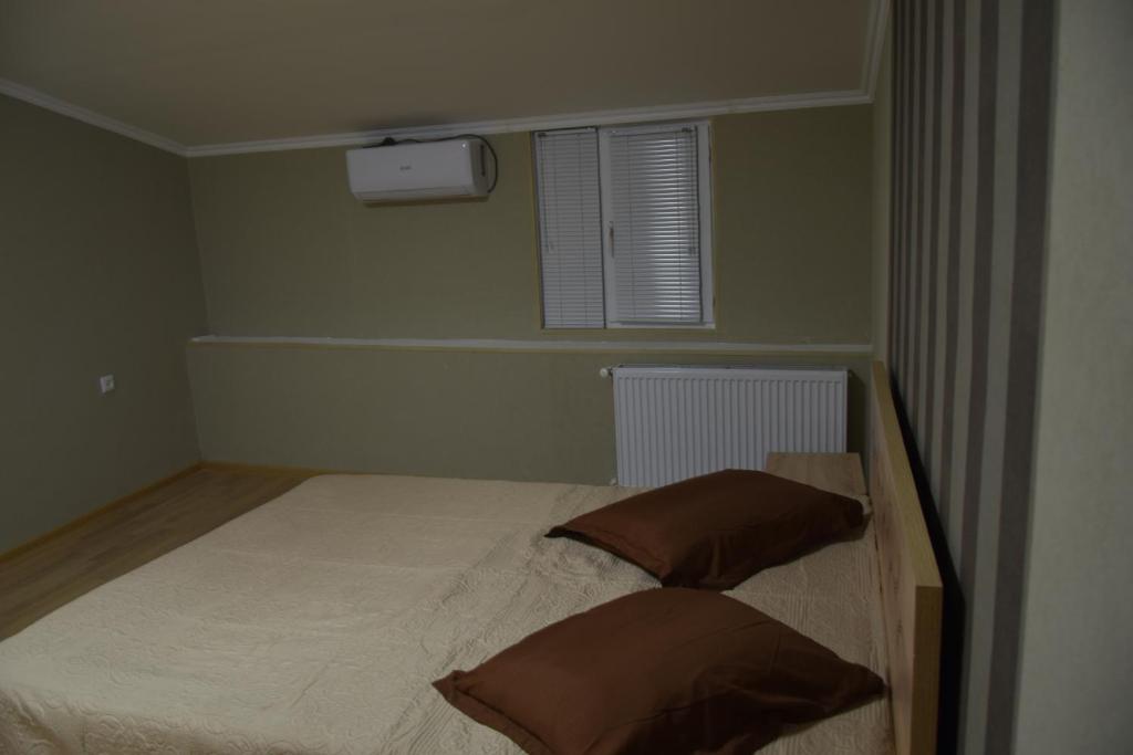 Postel nebo postele na pokoji v ubytování gogoli family hotel