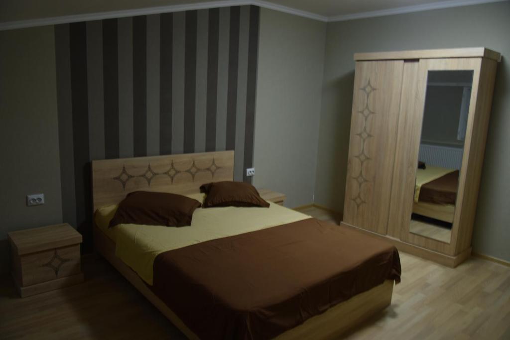Postel nebo postele na pokoji v ubytování gogoli family hotel
