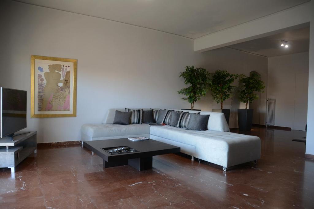 a living room with a couch and a coffee table at Modern & Classy Central Apartment in Athens