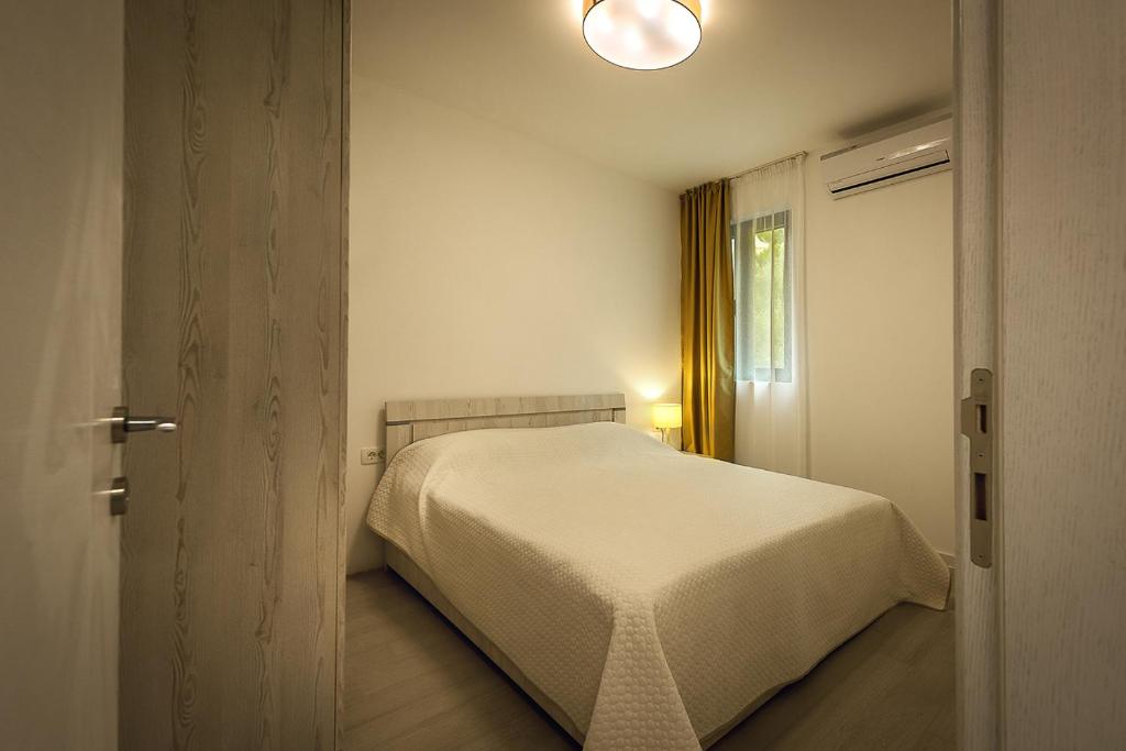 Postel nebo postele na pokoji v ubytování Adria lux apartmens 2