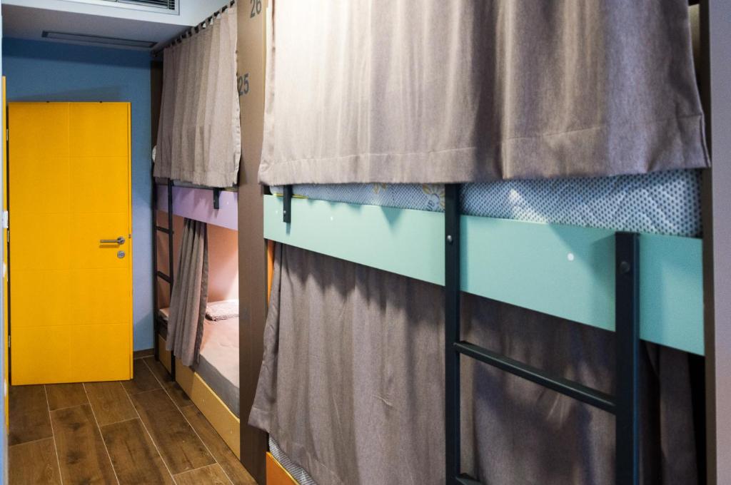 Postel nebo postele na pokoji v ubytování Ura Hostel