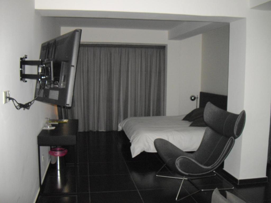 Postel nebo postele na pokoji v ubytování Crystal Hotel