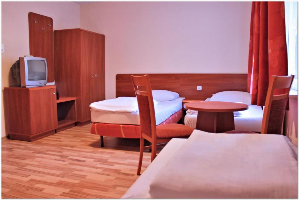 Postel nebo postele na pokoji v ubytování City Hostel