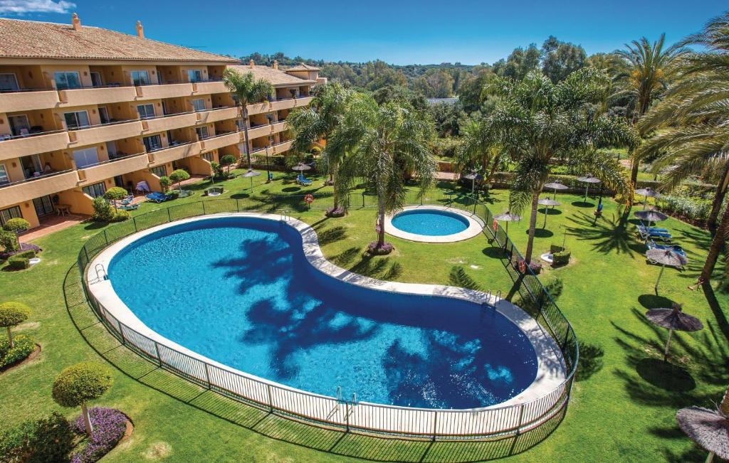an overhead view of a swimming pool in a resort at Amazing Apartment In Marbella-elviria With Swimming Pool in Marbella