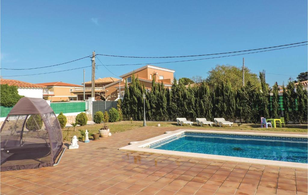 The swimming pool at or close to Stunning Home In Miami-Platja With Wifi