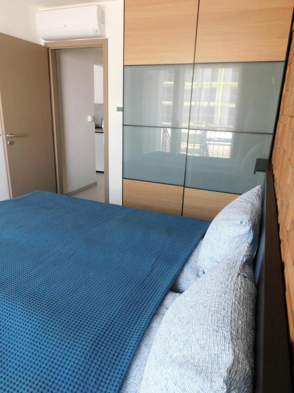 Postel nebo postele na pokoji v ubytování K&K Apartment Siófok