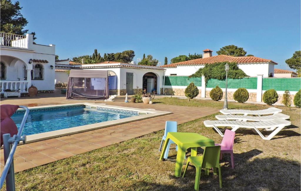 The swimming pool at or close to Stunning Home In Miami-Platja With Wifi